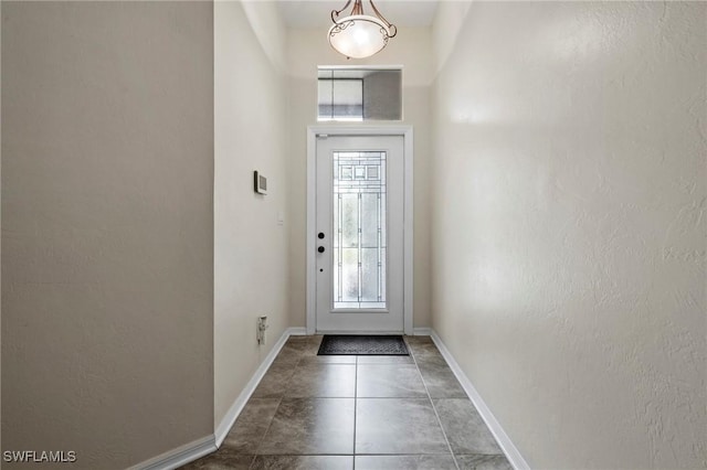 17971 Bermuda Dunes Dr, Fort Myers, FL 33967 - foyer entrance with tile patterned floors and a textured wall