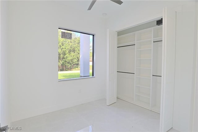 1803 Venice Ave N, Lehigh Acres, FL 33971 - unfurnished bedroom with a closet and a ceiling fan