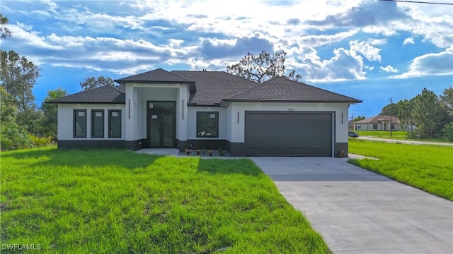 1803 Venice Ave N, Lehigh Acres, FL 33971 - view of front of property with stucco siding, concrete driveway, a front yard, and an attached garage