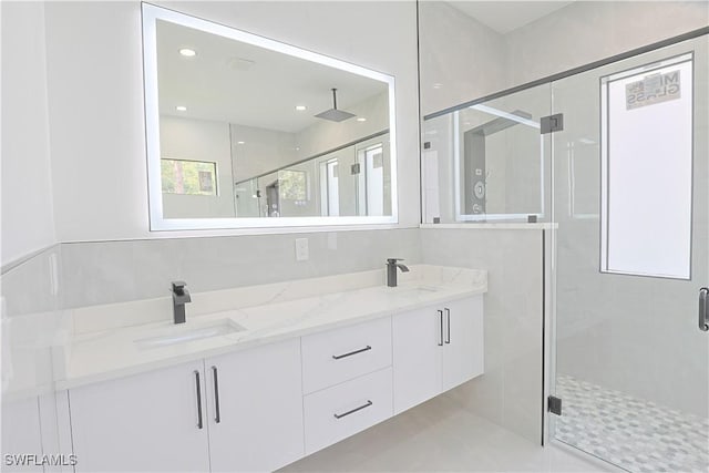 1803 Venice Ave N, Lehigh Acres, FL 33971 - full bathroom featuring a stall shower, double vanity, and recessed lighting