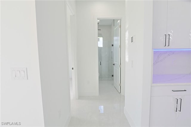 1803 Venice Ave N, Lehigh Acres, FL 33971 - corridor with baseboards and light tile patterned floors