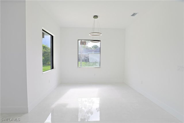 1803 Venice Ave N, Lehigh Acres, FL 33971 - unfurnished room featuring baseboards and light tile patterned floors