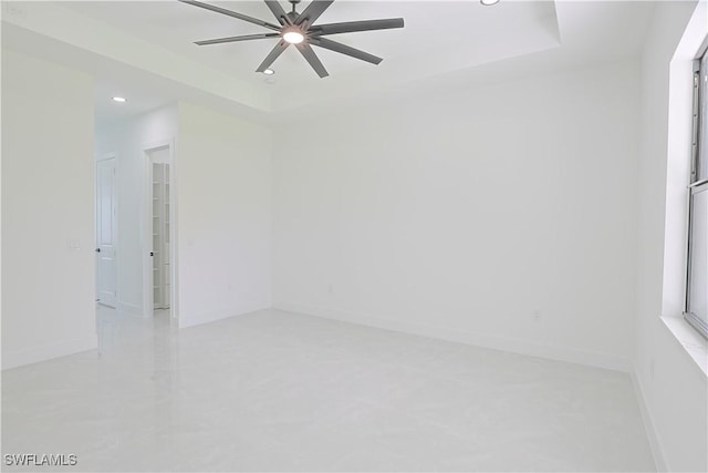 1803 Venice Ave N, Lehigh Acres, FL 33971 - spare room featuring recessed lighting, a ceiling fan, and a raised ceiling