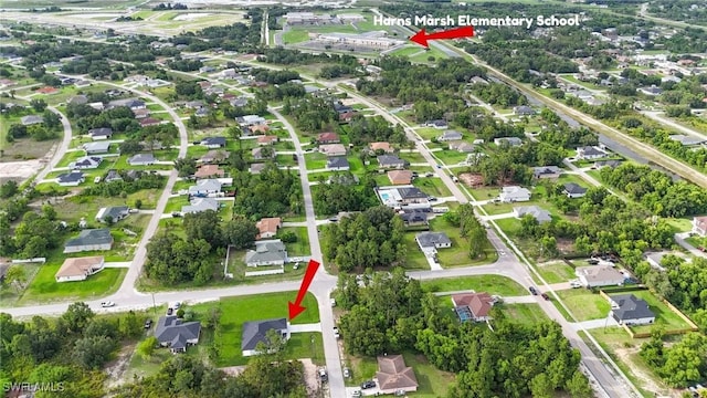 1803 Venice Ave N, Lehigh Acres, FL 33971 - aerial overview of property's location with nearby suburban area
