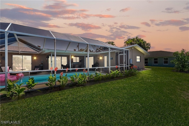 4622 SW 10th Ave, Cape Coral, FL 33914 - back of property with a yard, an outdoor pool, glass enclosure, and a patio area