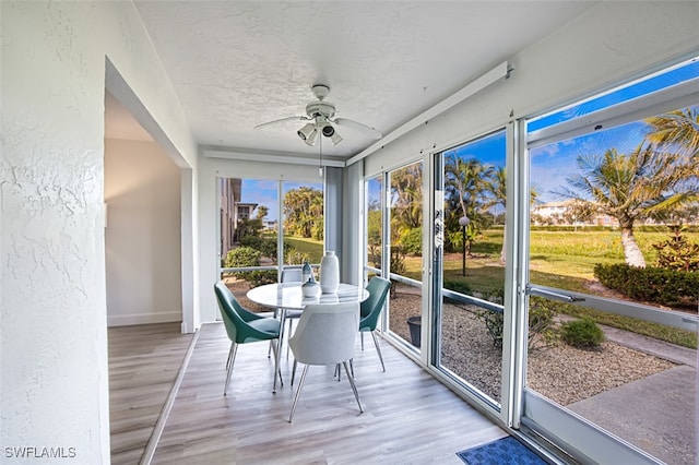 16251 Dublin Cir Unit F101, Fort Myers, FL 33908 - sunroom featuring a ceiling fan and outdoor dining area