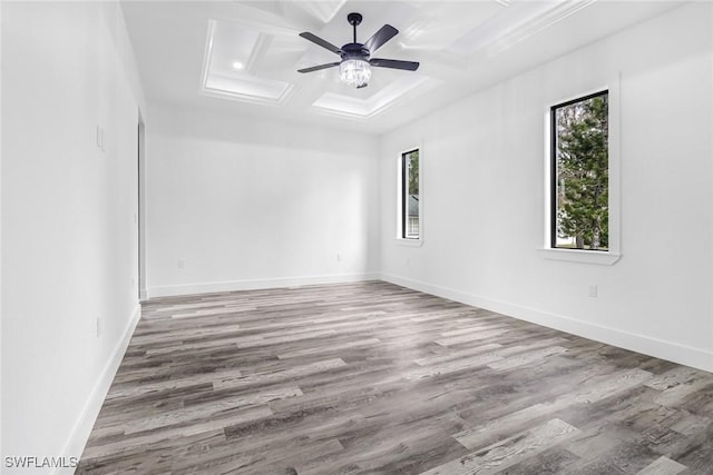 2714 24th St W, Lehigh Acres, FL 33971 - unfurnished room with coffered ceiling, healthy amount of natural light, wood finished floors, beamed ceiling, and attic access