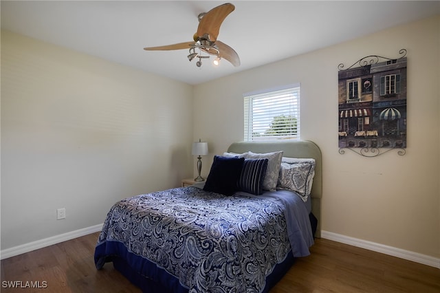 559 Woodruff St, North Fort Myers, FL 33903 - bedroom with wood finished floors and ceiling fan