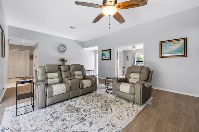 living area featuring ceiling fan and wood finished floors