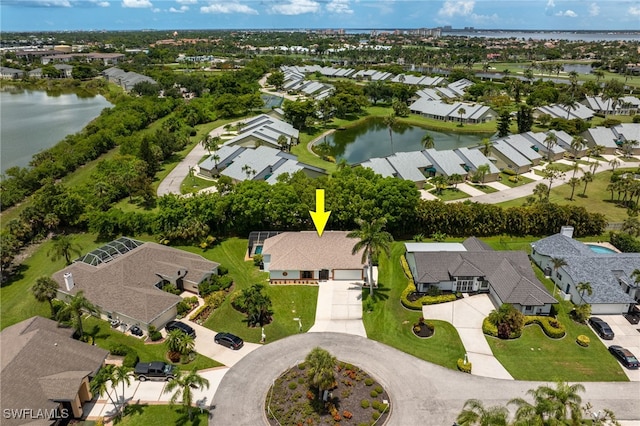 aerial overview of property's location with nearby suburban area and a nearby body of water
