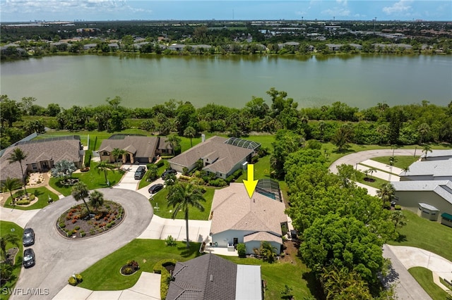 aerial perspective of suburban area with a nearby body of water