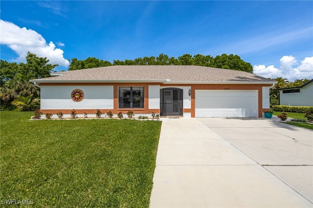 ranch-style home with stucco siding, a garage, a front yard, and concrete driveway