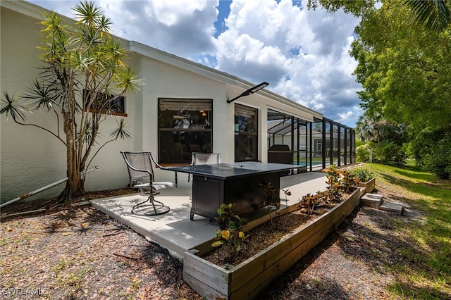 view of patio featuring a lanai and a swimming pool