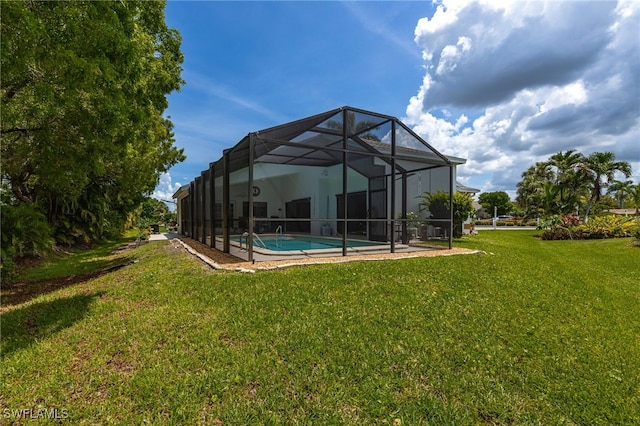 back of property featuring a lawn, a lanai, and an outdoor pool