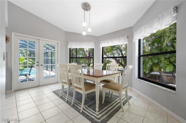dining room with french doors and light tile patterned flooring