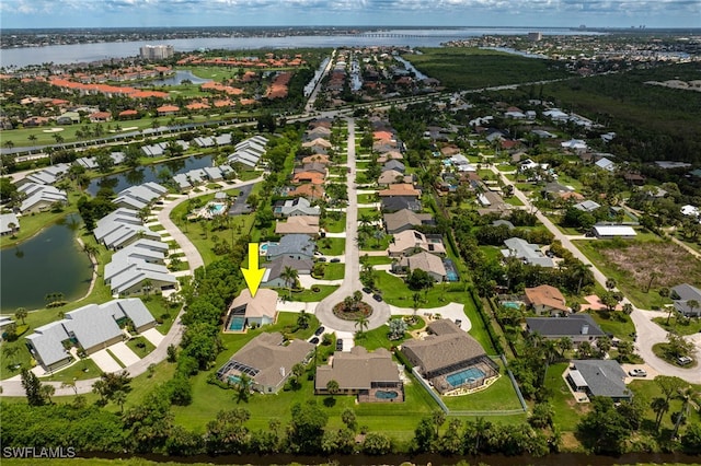 aerial overview of property's location featuring nearby suburban area and a large body of water