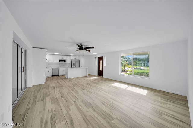 3307 Pinetree St, Port Charlotte, FL 33952 - unfurnished living room with ceiling fan, light wood-style flooring, and recessed lighting