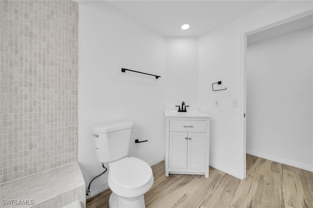 3307 Pinetree St, Port Charlotte, FL 33952 - full bathroom with wood finished floors, vanity, and tiled shower