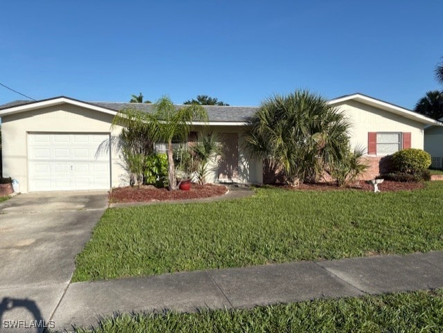 4425 N Atlantic Cir, North Fort Myers, FL 33903 - single story home with an attached garage, driveway, a front lawn, and stucco siding