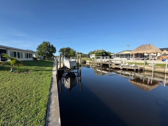 4425 N Atlantic Cir, North Fort Myers, FL 33903 - dock area featuring boat lift, a yard, and a water view