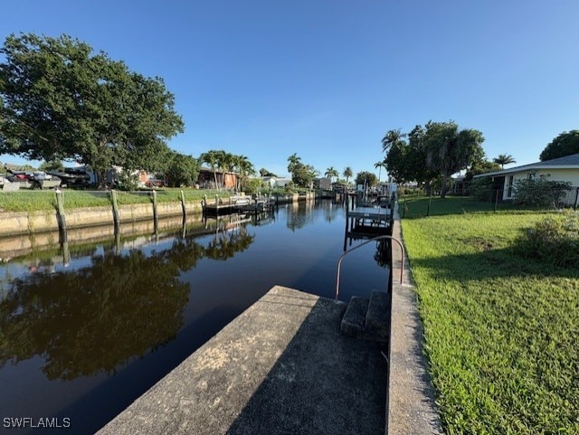 4425 N Atlantic Cir, North Fort Myers, FL 33903 - dock area featuring a yard and a water view