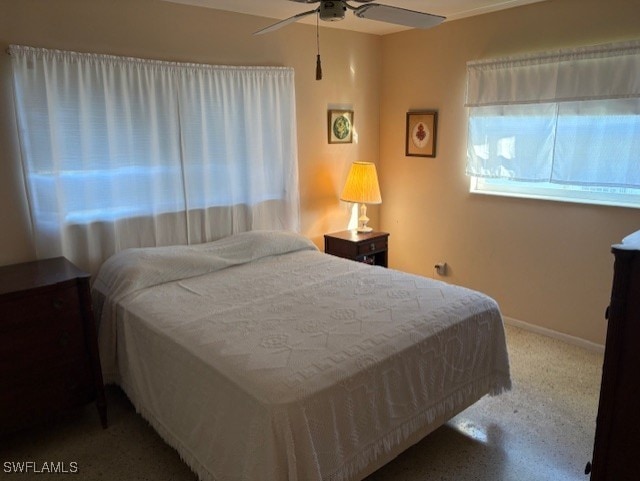 4425 N Atlantic Cir, North Fort Myers, FL 33903 - bedroom with baseboards and ceiling fan