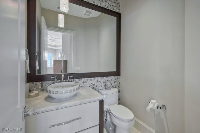 bathroom featuring tasteful backsplash and vanity