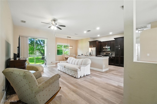 3271 Lemon Ln, Naples, FL 34120 - living room featuring ceiling fan, light wood-type flooring, and recessed lighting