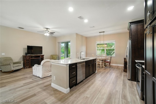 3271 Lemon Ln, Naples, FL 34120 - kitchen with stainless steel appliances, healthy amount of natural light, a kitchen island with sink, ceiling fan, and recessed lighting