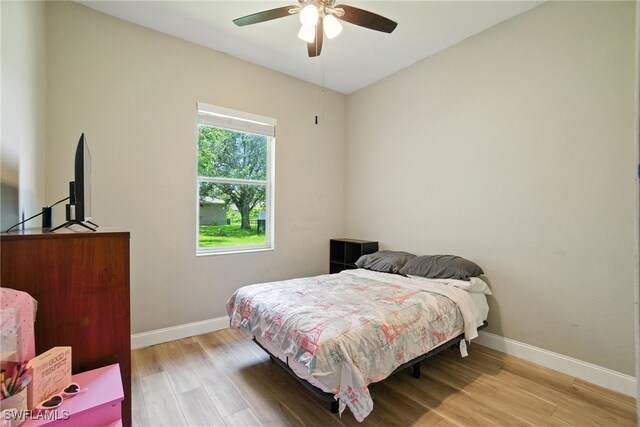 3271 Lemon Ln, Naples, FL 34120 - bedroom with light wood-type flooring and a ceiling fan