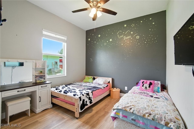 3271 Lemon Ln, Naples, FL 34120 - bedroom with light wood-style flooring and ceiling fan