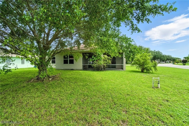 3271 Lemon Ln, Naples, FL 34120 - view of grassy yard featuring a sunroom
