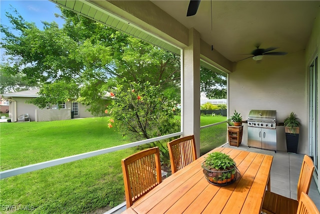 3271 Lemon Ln, Naples, FL 34120 - wooden deck featuring a ceiling fan, a yard, and area for grilling