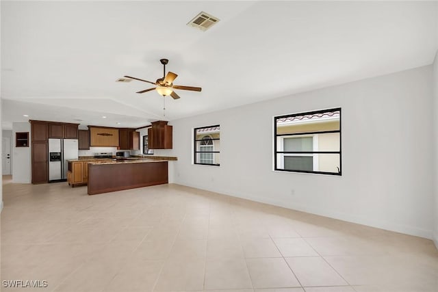 519 99th Ave N, Naples, FL 34108 - kitchen featuring stainless steel fridge with ice dispenser, open floor plan, lofted ceiling, a ceiling fan, and a peninsula