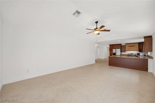 519 99th Ave N, Naples, FL 34108 - unfurnished living room with vaulted ceiling, a ceiling fan, light tile patterned floors, and recessed lighting