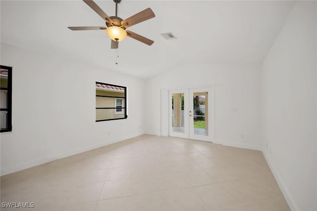 519 99th Ave N, Naples, FL 34108 - empty room featuring vaulted ceiling, french doors, light tile patterned flooring, and ceiling fan