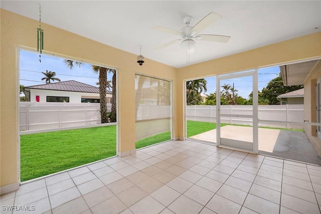 519 99th Ave N, Naples, FL 34108 - unfurnished sunroom with a ceiling fan