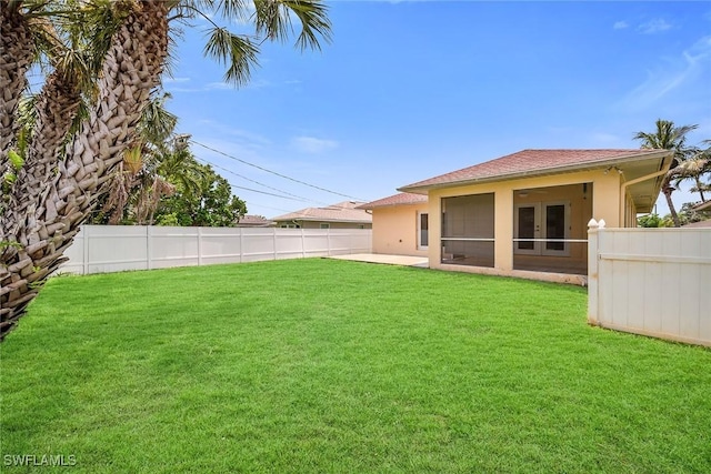 519 99th Ave N, Naples, FL 34108 - fenced backyard with french doors