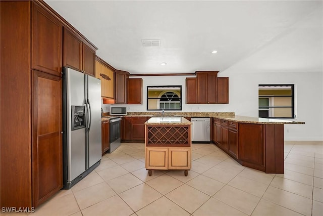 519 99th Ave N, Naples, FL 34108 - kitchen featuring stainless steel appliances, a peninsula, light tile patterned flooring, a center island, and recessed lighting