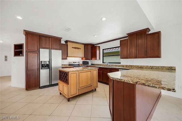 519 99th Ave N, Naples, FL 34108 - kitchen with appliances with stainless steel finishes, a peninsula, light stone countertops, light tile patterned floors, and recessed lighting