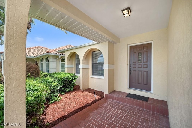 519 99th Ave N, Naples, FL 34108 - doorway to property with stucco siding