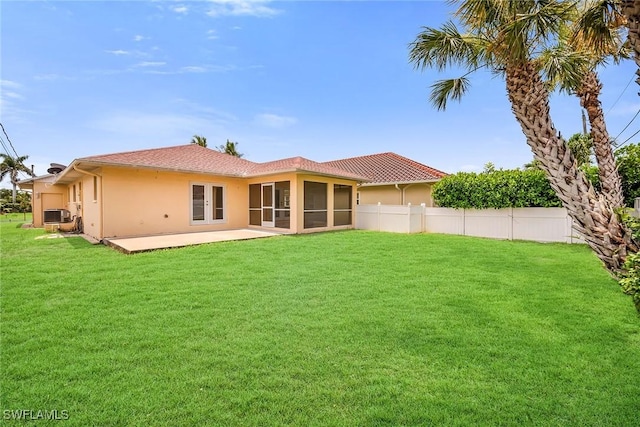 519 99th Ave N, Naples, FL 34108 - back of property featuring stucco siding, a sunroom, a patio, and french doors