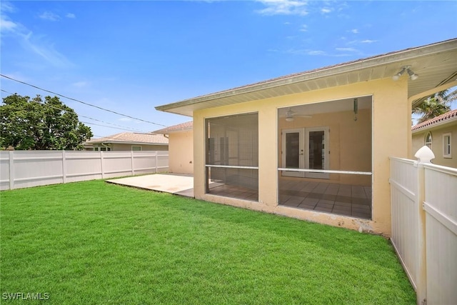 519 99th Ave N, Naples, FL 34108 - back of property with a fenced backyard, a patio, and stucco siding