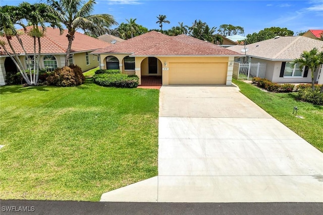 519 99th Ave N, Naples, FL 34108 - view of front facade with a garage, stucco siding, and driveway