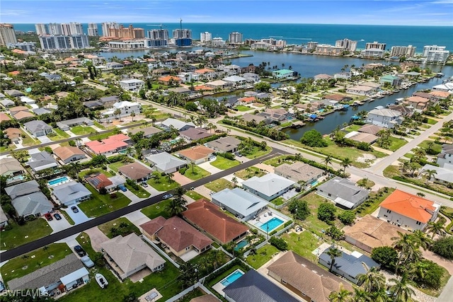 519 99th Ave N, Naples, FL 34108 - aerial overview of property's location featuring a large body of water and nearby suburban area