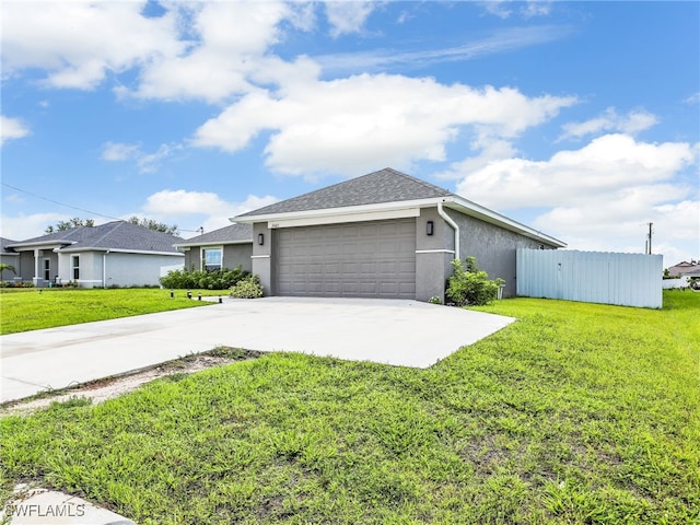 2405 Nelson Rd N, Cape Coral, FL 33993 - view of side of home featuring driveway, an attached garage, and stucco siding