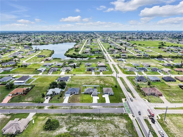 2405 Nelson Rd N, Cape Coral, FL 33993 - aerial view of property and surrounding area featuring a large body of water and nearby suburban area