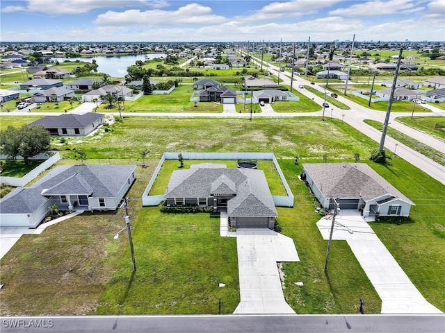 2405 Nelson Rd N, Cape Coral, FL 33993 - aerial view of residential area featuring a large body of water