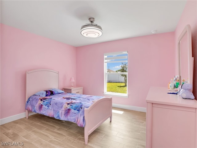 2405 Nelson Rd N, Cape Coral, FL 33993 - bedroom with light wood-style flooring