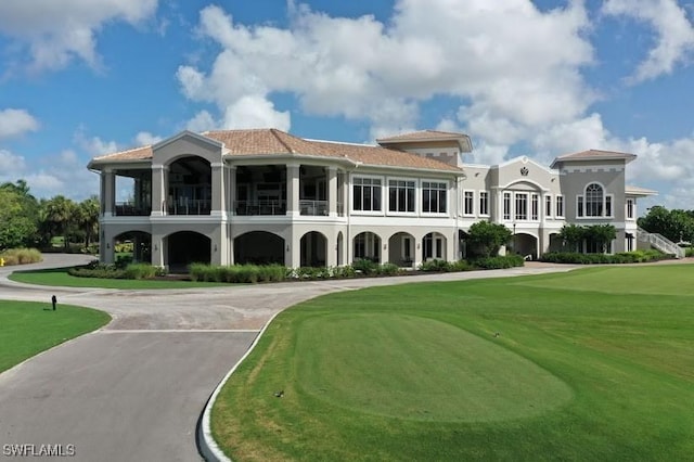 1140 Sarah Jean Cir Unit C-205, Naples, FL 34110 - view of community featuring curved driveway, a yard, and view of golf course
